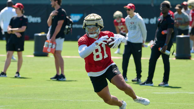 Jul 27, 2023; Santa Clara, CA, USA; San Francisco 49ers tight end Cameron Latu (81) runs with the football after making a catch during training camp at the SAP Performance Facility. Mandatory Credit: Robert Edwards-USA TODAY Sports  